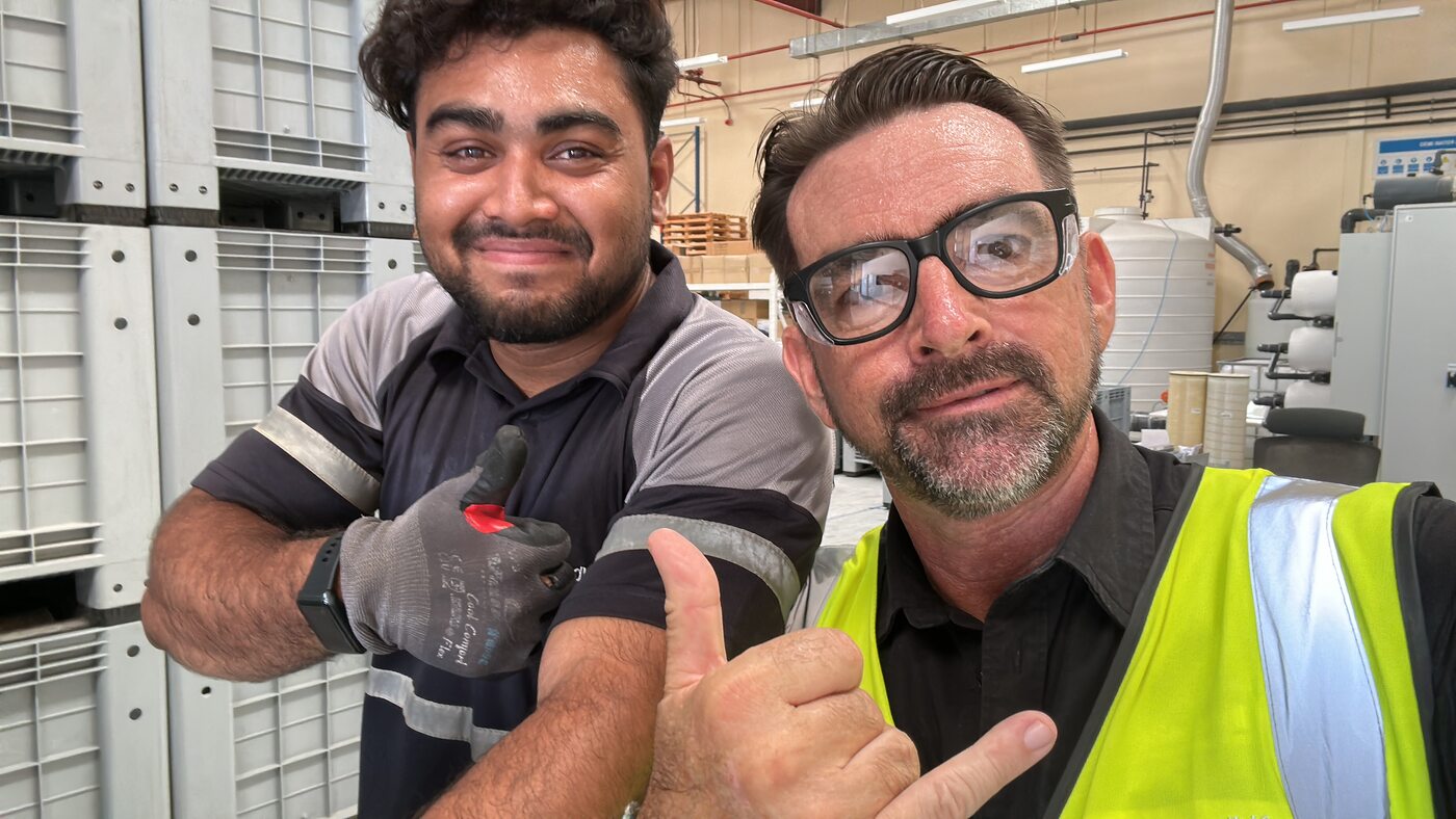 Morgan Meinecke with one of the plant operators on the regeneration floor